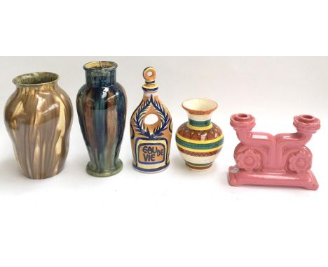 Three vases, one Quimper, a majollica 'eau de vie' bottle, and a pink ceramic candleholder