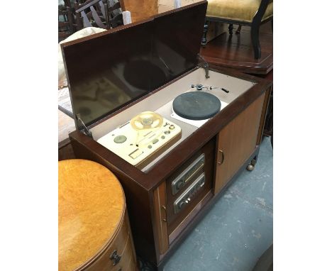 A mid-century radiogram, double lids lifting to reveal a Garrard Model 301 turntable; Telefunken Magnetophon 85; tambour fron