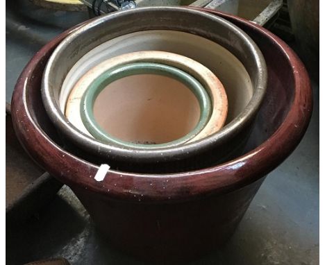 Four ceramic garden planters, the largest 50cmD 