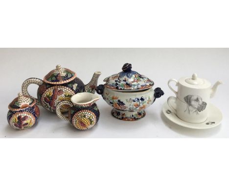 A mosaic style teapot, milk jug and sugar pot ; together with a 'Reflections Fine Bone China' tea for one set, decorated with