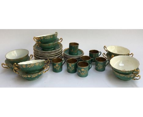 A Copeland Spode part dinner service, green heightened in gilt, approx. 37 pieces, includes coffee cans, saucers and lovers c