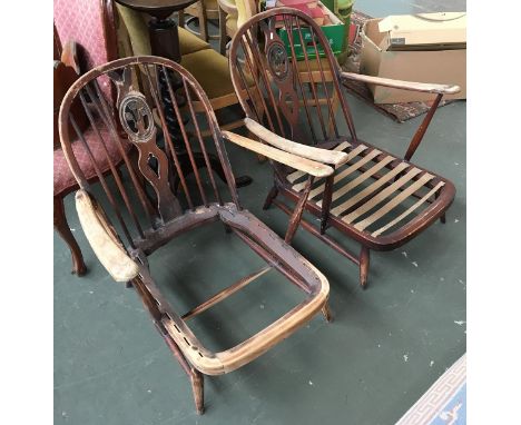 A pair of Ercol low stick back open armchairs, in need of re-upholstering 