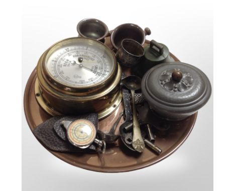 A grop of metal wares including continental brass ship's-style barometer, circular copper tray, cutlery, pedometer, hammered 