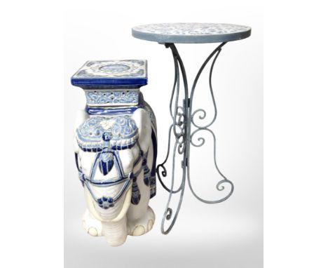 A glazed ceramic elephant plant stand, height 43cm, together with a wrought-metal circular table.