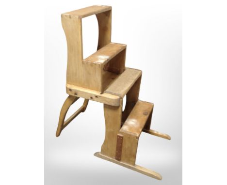 An early-20th century folding pine metamorphic library step chair.