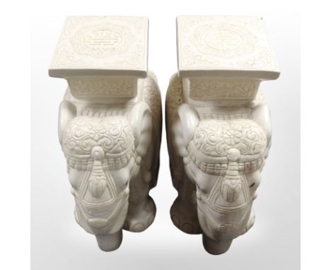 A pair of glazed ceramic elephant plant stands, height 44cm.