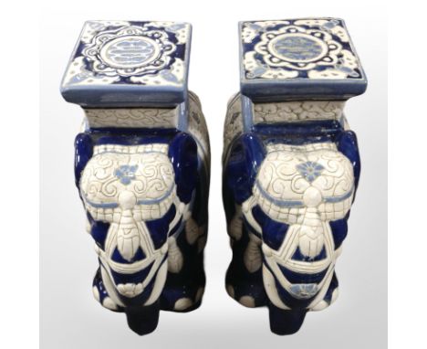 A pair of glazed ceramic elephant plant stands, height 42cm.