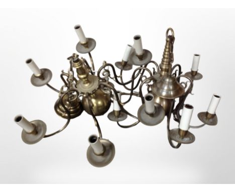 Two brass six-sconce pendant light fittings, wired for electricity, diameter 57cm.