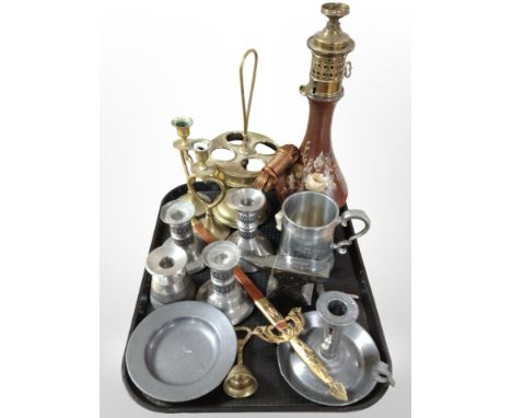 A group of metal wares including pewter ejector candlestick, further pewter and brass candlesticks, miniature anvil paperweig