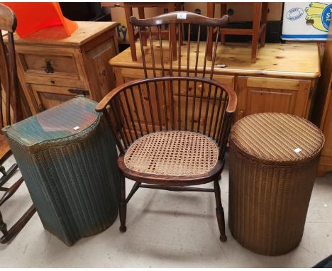 An Arts &amp; Crafts comb back chair with cane seat; a Lloyd Loom cylindrical linen basket; another with shaped front