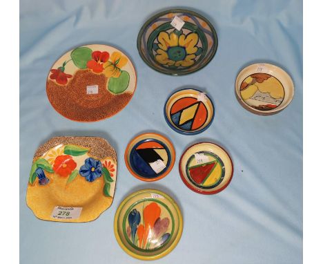 Three small circular Clarice Cliff dishes / ashtrays with geometric decoration , diameter 7cm; 2 similar dishes, landscape sc