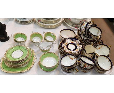 An Edwardian Japan pattern part tea service, 36 pieces; an "Old English" green &amp; gilt part tea set, 21 pieces approx 