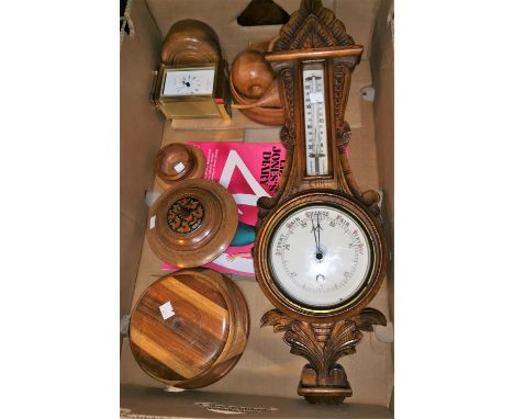 An Edwardian barometer with thermometer in carved oak case; a carriage clock; treen; etc. 