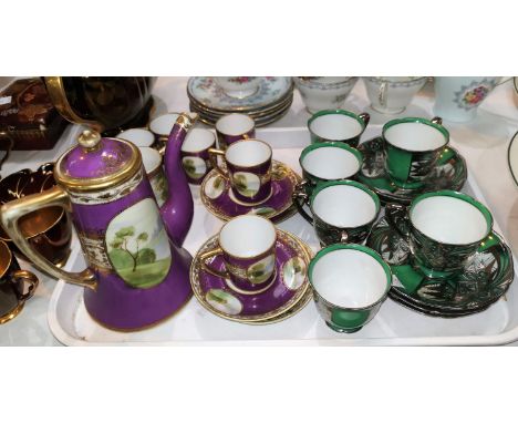 A Noritake 15 piece coffee set in purple and gilt with hand painted landscape vignettes; a Noritake set of 6 coffee cups and 