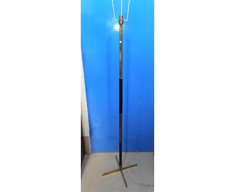 An Art Deco brass standard lamp on 4 feet 