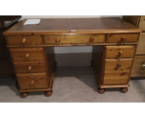 A Ducal pine twin pedestal desk inset tooled leather writing surface, 120 x 62 cm 