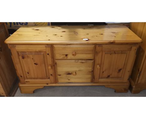 A Ducal pine side cabinet, fitted drawers and cupboards, 110 cm 