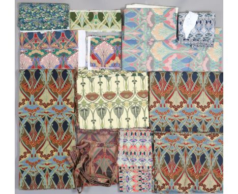 A large quantity of assorted textiles including various Liberty pattern fabrics (mostly for cushion upholstery) &amp; various