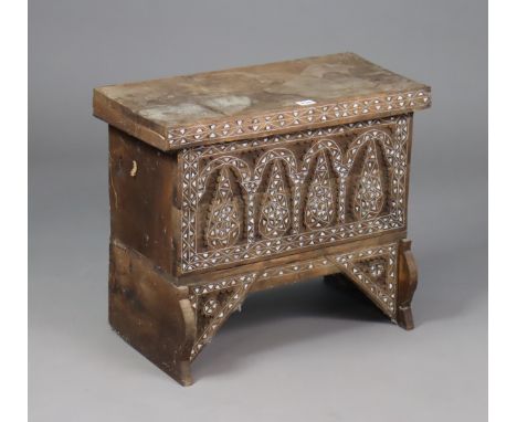 An eastern-style mother-of-pearl inlaid small wooden trunk with a hinged lift-lid, 54.5cm wide x 47cm high x 26cm deep.