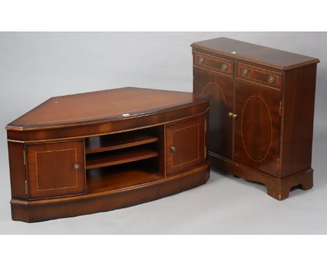 An inlaid-mahogany bow-front dwarf cabinet with open shelf to centre flanked by a cupboard to either side enclosed by a panel