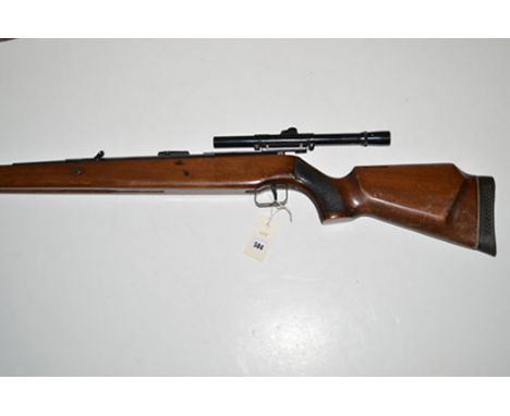 An "Original" model 50 .22 calibre under lever air rifle, with stained beech stock, fitted a 4 x 15 BSA air rifle scope.