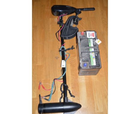 A Daiwa Model 36T electric battery operated outboard motor, motor instructions; and a battery.