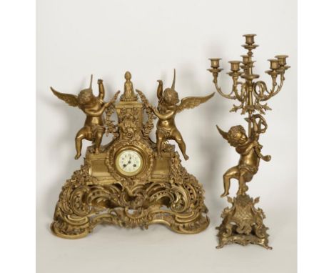 A LARGE 19TH FRENCH GILT METAL MANTLE CLOCK, the circular dial with decorated centre with a two train movement flanked by two