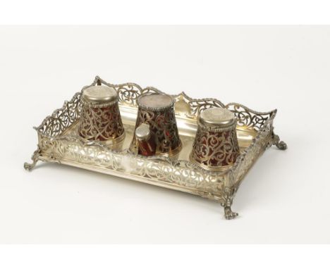 A VICTORIAN GALLERY INKSTAND of rectangular form with a raised gadrooned and pierced border, housing two inkwells and a sande