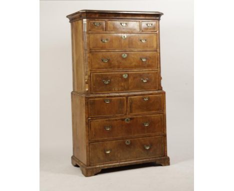 A GEORGE II WALNUT CHEST ON CHEST with canted reeded moulded corners, the three small drawers to the upper frieze and three l