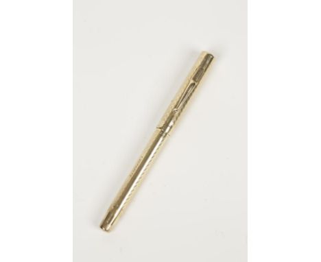 MUST DE CARTIER: A YELLOW GOLD PLATED FOUNTAIN PEN,  with engine turned linear chequer decoration, with makers mark and monog