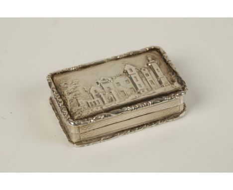 A WILLIAM IV "CASTLE-TOP" VINAIGRETTE, the hinged cover depicting Abbotsford House, with raised foliate borders, engine-turne