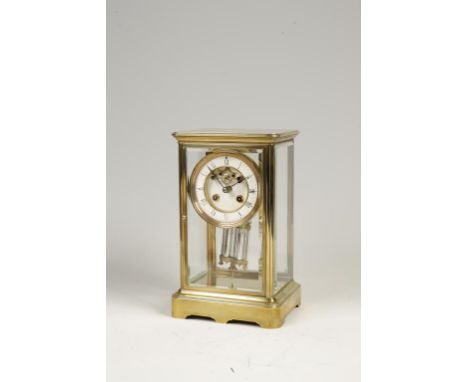 A VICTORIAN BRASS FOUR-GLASS MANTLE CLOCK, with visible balance wheel to the dial, two winding holes and a mercury pendulum, 
