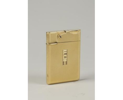 ASPREY AND CO LTD: AN 18CT YELLOW GOLD CIGARETTE LIGHTER, engine turned overall with engraved initials 'FCT' , hallmarked, c.