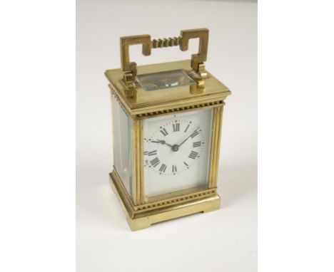 A FRENCH BRASS CASE CARRIAGE CLOCK, the white enamel dial with Roman numerals, the movement stamped "R & Co. Made in Paris", 