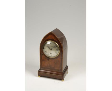 GRIFFIN AND ADAMS, LONDON: A VICTORIAN GOTHIC REVIVAL TABLE CLOCK, the silvered dial with a single winding hole, the mahogany