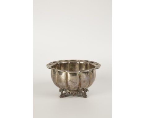 A WILLIAM IV IRISH SUGAR BOWL of lobed form with a raised reeded border, on shell capped bracket feet, crested, by James Fray