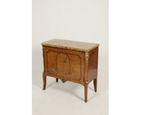 A LOUIS XVI MARBLE TOP COMMODE, the rectangular top with moulded border and rounded corners above twin cupboard doors with ki
