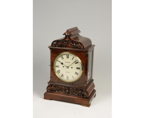 DONNE, LONDON: A 19TH CENTURY TWIN CHAIN FUSEE MAHOGANY TABLE CLOCK, with carved case and shaped pediment, striking on a gong