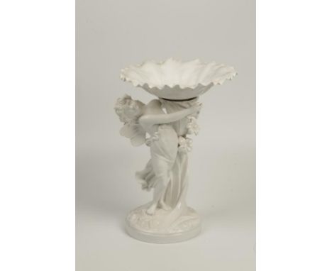 SPODE CERAMIC COMPORT with flared dish supported on a foliate column flanked by a loosely clad winged maiden on naturalistic 