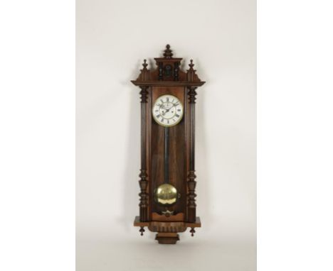 A VIENNA WALL CLOCK, in a mahogany glazed front case, with two train movement and subsidiary seconds dial, 46" high
