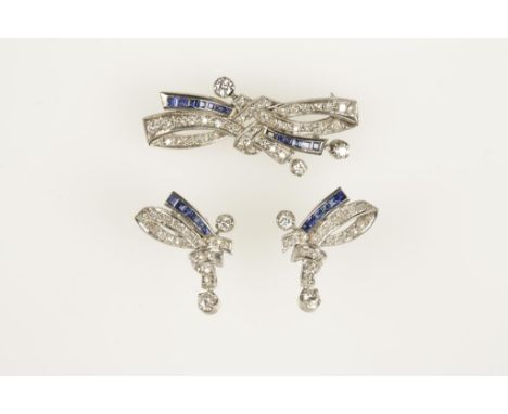 A 1950'S DIAMOND AND SAPPHIRE BROOCH AND EARRING SUITE, the brooch modelled as a stylised double ribbon tie milligrain-set ov