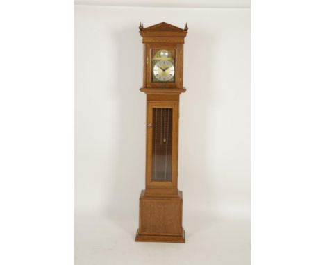 A MODERN OAK CASED 'GRANDMOTHER' LONGCASE CLOCK, with brass corner spandrels to the archtop dial, in a golden oak architectur