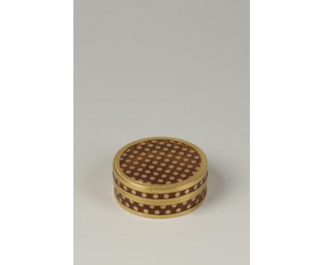 A TORTOISESHELL AND GOLD PIQUE SNUFF BOX, of circular form, with swirl engraved dot pique overall, within gold rims, indistin