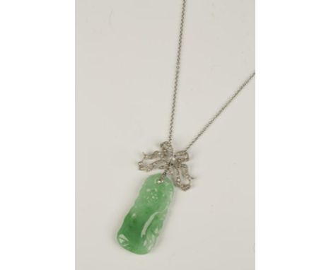 A GREEN JADEITE AND DIAMOND PENDANT, the green jadeite pendant carved and pierced with a heron and flowers, c. 4.8cm long, wi