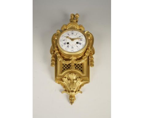 A LOUIS XVI STYLE ORMOLU "CARTEL" TYPE WALL CLOCK, the white enamel dial with painted foliate decoration with a two train mov
