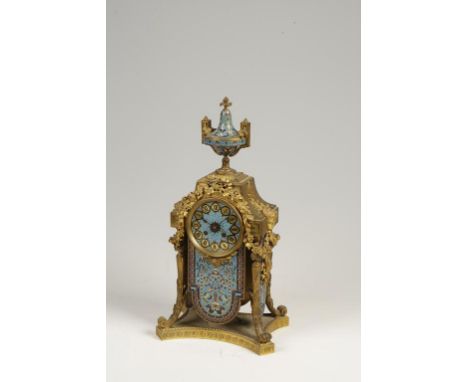 AN ORMOLU AND CHAMPLEVE ENAMEL CASED MANTLE CLOCK, the circular dial with Roman numerals against a turquoise ground, with an 