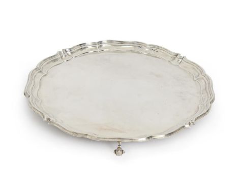 A George VI silver salver, on four volute feet, 36cm diam, by Harrison Brothers and Howson, Sheffield 1944, 41ozs  Light poli