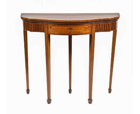 A satinwood and inlaid card table, early 20th c, in neo classical style, on five square tapered legs with spade feet, 77cm h;