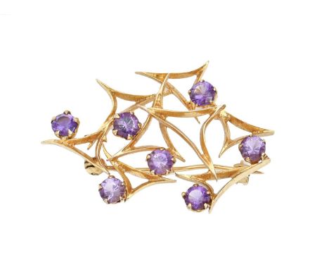 An amethyst asymmetrical brooch, in gold, 41mm, 6.1g  Pine slightly bent and a few light scratches