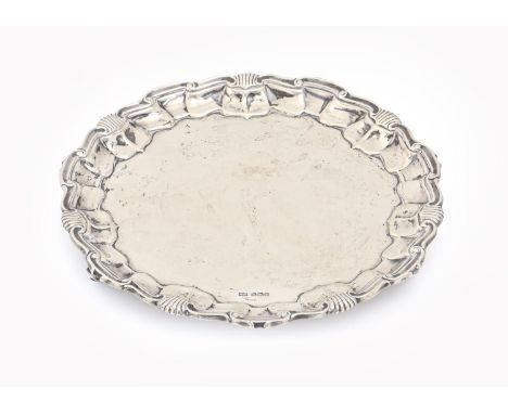 A George V silver salver, on three volute feet, 19.5cm diam, by Mappin &amp; Webb, Sheffield 1911, 11ozs 10dwts  Light polish